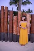 It's so simple but so elegant. I know it was supposed to be a midi-dress, but it worked out for me regardless! I bought this for my honeymoon trip in Bora Bora and there are no regrets. It hits me a little above the ankle in terms of length. The material feels nice and not cheap at all. It does wrinkle easily, but a bit of steaming does the trick. - Lanvi N.