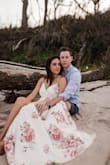 Ladies, if you're looking for a dress for your engagement photo session, please look no further. This dress is absolutely stunning (see photos for proof.) I originally ordered a small but the bust was just slightly too small for my boobs, the tiny snap wouldn't stay buttoned. I opted to get a medium instead of trying to get it tailored and it worked just fine! It was a little big, as in there was a little too much dress, but I wrapped it extra tight and you can't even tell! Shorties, please note it runs LONG. I will need to get this baby hemmed in time to wear it as my wedding after party/brunch the next day dress. - Kayla