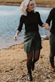 This skirt is so cute and the vegan leather is very soft. My only complaint was that when I buckled the second button to wrap it there was a gap on my hip where the button was because it didn't fold all the way. - Whitney C.