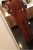 It does run a little big. I usually wear a medium, sometimes a small. After reading reviews I got a small. It was perfect! I got it for a 70's theme wedding - I got SO many compliments! It's soft too! - Kelly F.