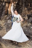 This dress was absolutely perfect for my relaxed country wedding! It was light and cool for our 43 degree celcius wedding day. I got red dirt all over it which easily came out. Naturally suited my curvy shape. Plus it beautifully fans out when you twirl!
I wore stick on bras to keep my 'girls' up for 8hrs, which ensured I didn't get that tucked material look under my 'girls' like some. I also had it hemmed slightly & taken in around the bodice. 
My dress was shipped out to Australia and arrived exactly when stated in the shipping information. 
Couldn't recommend this dress or Lulus higher! - Chloe D.