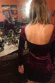 I love this dress - I especially like how I can wear it without a bra as its a tight fit all around. I wore this with a pair of darker nylon tights and black combat boots since it was freezing and I was doing a concert after my holiday party - would look great with bare legs & heels. Sorry for the terrible pics as I didn't get any that night! I would recommend this dress. - Beth M.