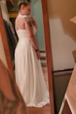 This dress is gorgeous, I was looking for a simple yet elegant dress for my spring wedding. I came across this dress and fell in love. I immediately ordered it and recieved very quickly! As soon as I put it on I knew it was the perfect dress. I felt so beautiful and didnt even want to take it off! It fits perfectly (besides being long since I am so short) but I just need to get it hemmed. I cannot wait to wear this dress on my wedding day. - Katrina S.