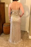 This dress is very pretty. I tried both the S and XS and decided I liked the fit of the XS better. It's very long, so I plan on getting it hemmed. I'm wearing 4" heels in the pics. It does hug and cling to the body, so I'll be wearing spanx with it to smooth out the look. - K G.