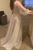The dress is pretty heavy and really good quality. It is way too long for me but luckily I am just using it for my engagement photos. The back of the dress is very big and when I move it creates gaps but if I fashion tape it, it makes it better. It's an absolutely gorgeous dress. I didn't give it 5 starts due to the extremely long length and how it doesn't fit right in the back. - Courtney A.
