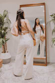 Ugh where do I even begin?! Beyond obsessed with this gorgeous neutral jumpsuit that is perfect for almost any occasion. It fits like a glove & the criss cross string detail on the back is to die for. It's such a classic & effortless look. If you don't own it, you need to! - Laura B.