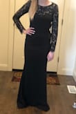 The back of the dress is really pretty! It does run a little large and is baggier on the tummy. First ordered a small and had to return it for an XS and that fit much better. Will need to get it hemmed because it's a little too long. Overall, a really cute dress though. - Hannah W.