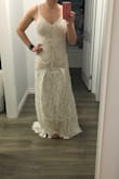 Fits as expected. There is a little stretch which made it super comfy. The pleats in the front were a bit weird so I'm having a seamstress reverse them. Other than that it's great. A perfect wedding dress for someone not looking to spend a ton of money. - Emma H.