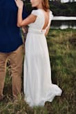 I was searching the internet for a long flowy dress for engagement pictures (it's winter, so stores aren't carrying anything good) and came across this beauty from Lulus. I was torn between what color.. went with the cream and happy I did! The material is good and there are a couple layers so you can't see through anything. - Jessica M.