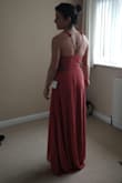 Bought for sister's wedding. Dress is lovely and the wrap feature means it can be cinched where needed. Long train if you're not super tall (I'm 5'6" and had 3" heels on and it still dragged a good few inches behind me). Fabric is polyester so bit of a shame, especially for the price! Also horrible frill things on shoulders are a nightmare if you have anything other than slight/narrow shoulders and I've had to take it to the seamstress to get them altered. Shame they send it parcelforce rather than royal mail as it got stuck in customs and I had to pay an additional £41 worth of fees. Due to this, coupled with the price in regards to a mainly polyester dress, I wouldn't purchase anything from here again. - Caroline S.
