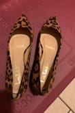 Really cute, as you can see from the photo. There is a slight cushion on the inside for comfort. I had enough space however when walking I get pain in the front on my toes. Other than the fact they hurt (maybe breaking in?) I enjoyed it. - Beth P.
