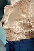 The fabric, style, detail and color is fabulous! Perfect crop top for high waist paper bag pants or almost any high waist pants. HOWEVER, it was too baggy in the chest (and I'm pretty busty for my size). The slit in the front was exposing my goods and it should work out better with a size "small" instead (and double-sided tape).
Upstate: I ordered a size small. But, I still had issues in the chest area. I'm going to keep it but I'm gonna have to figure out the double-sided tape situation. - Chancie H.