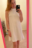 This dress is very flattering for petite gals! I'll be wearing for my engagement photos on the beach. I am having some issues finding an undergarment that would work (You can see the outline of silicon petals). - Kyra S.
