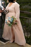 I wore this for our nontraditional, small wedding. I had to get the sleeve cuffs brought in, the bottom hemmed, and they put a hook and eye on the chest, but even so, it was truly perfect. It was so comfortable, flattering, and traveled so well. It was exactly what I was looking for. I wish I could wear it again! - Jencie R.
