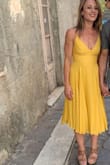 Fits like a glove. Flows beautifully and fits well. I got so many compliments on this. No bra needed and not possible to wear one with this dress. Great for summer. The top can loosen so just make sure it's tied tight enough. - Maria C.