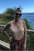 Very versatile top. My favorite look is tied in the front with high waisted white shorts! Soft and breathable material! - Caylee C.