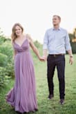 I wore this for my engagement shoot and it was a perfect choice. The color is very true to the image and very flattering. The twirling depicted is also spot on- this dress is perfect if you want that dramatic dress shot. The front is separate though (you can see that in my first photo. Not an issue though. I wore 3 inch heels and did not need to have it hemmed. It also looks really great with a denim shirt tucked over it! I'm small on top and the bust was a bit loose. I would have altered it but I ran out of time. Only thing to know is because there is a lot of fabric, you could get hot in it and if your traveling, this dress will add weight to your suitcase. - Christine B.