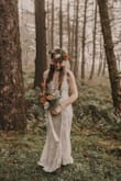 This dress is so beautiful and very well made! It is light and elegant with beautiful lace embroidery! I used it for my beach elopement, and was in love with the dress! After reading previous reviews, I decided to get one size smaller that I would normally wear and was very happy I did! The XS fit me like a small, and I honestly could have sized down again if there were such a thing as the bust area was a little baggy on me. Otherwise it was perfect! - Lindsay A.