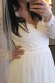 Ordered this dress for a Las Vegas elopement. I ordered a size small. It was way too big on my back, shoulders, chest and arms so I obviously had to get it tailored. I would order a size smaller than your usual. - Julie G.