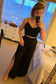 I bought this on a whim (I have expensive whims), and I'm so glad I did! The material of the crop top is thick and high quality, and because I can adjust the tightness of the straps and the back lacing, I don't need to wear a bra and can still feel supported. The pants were long, but when paired with about 3" heels there's probably no need to hem (my legs are "regular" length in terms of jean sizes - neither short nor tall). As other reviewers have said, the side slits are HIGH so when you sit and the material drapes away, you'll be showing full side thigh/cheek. (I"ll be self-tanning before breaking out this look.) I had a little trouble zipping them up in back on my own, so in my pictures the pants are on backwards. LOL. I might have sized up to a large since the waist was snug, but I had also just eaten a huge chicken breast right before try on. Overall, they are sexy and sassy and a definite keeper! - Tori L.