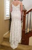 I had spent hours and hours shopping online for an affordable dress that would still make me feel beautiful on wedding day (having a very small and simple ceremony). I am now OBSESSED with Lulus. I love all of the customer photos in the reviews and this was extremely helpful when finally choosing this dress.
No one could believe this dress was $100. My only gripe is the adjustable strap, I think it looks a little tacky. BUT, for the price of this dress I could easily have it altered with a new strap and still have room in my budget $$$. I'll likely wear spanx to suck everything in for that special day but I could not be happier with the quality of the dress, especially for the price. The lace is gorgeous and it is LONG. I'm 6'0 and it's still overly long in the front and has the little train in the back (I also got a size XL). Shorter ladies might need to get it hemmed if you're not wearing high heels? All in all, you can't go wrong buying this dress. It's a beauty and I can't wait to wear it. - Carley H.