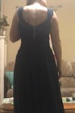 The dress fits nicely. The dress is great quality. I love the top of the dress. The sleeves are a bit odd but when you pull up the bottom sleeves to make one i think it looks nicer.  The bottom is a bit flowier than I like it but I am wearing this as a bridesmaid dress so what ever makes the bride happy. Great dress and site would highly recommend. - Sydney N.