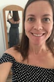 I got this dress to wear for a summer BBQ before my wedding weekend, and it is very cute on. The off-the-shoulder look dresses the print up a bit, and the shoulders are tight and secure. The materials is soft to the touch and the waist is flattering. I'll have to get it hemmed, but definitely a great dress! - Cara J.