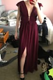 I was really worried about this dress because I have basically no boobs, and most of the images showed some cleavage. I was wearing this dress to a wedding that I was going to across the country (and of course, ordered it so late that it was going to HAVE to work) Luckily for me, it for perfectly (as have any other dresses I've ordered from this website) and I absolutely loved it. I also got tons of compliments, 10/10 would recommend! The ties and front split are such cute additions to the dress too! (unfortunately, I didn't take any great pictures that show the front of the dress, so don't mind my messy room lol) - Jenna L.