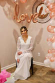 I loved this dress and everyone at my bridal shower thought it could very well be my wedding dress! I'm very happy with this purchase. I wish I would have gotten an XS. I'm not very busty so I didn't fill out the top. I even had to take the hem up by about 4 inches (and I was even wearing a 3 inch heel!) Which cost me about $75 at the tailor since it has three skirts. Aside from that, I LOVED this dress! - Venus M.