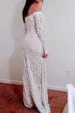 This dress is so beautiful! From the moment I tried on, I felt like a princess. The lace and off-shoulder style makes this a very special dress. I can't wait to wear it in a few weeks for my elopement! - Tassia D.