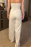 I really liked this jumpsuit and wanted to use it for my wedding rehearsal dinner. Unfortunately the cups were too large for me. I would've spent money to have it altered but since the alterations would include cups and a hem, I didn't think it was worth it. Other than the cups it fit well and material was thick and didn't feel cheap at all. If you can fill it out I would definitely recommend this. - Rae A.