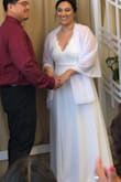 This dress was stunning. I bought this dress for my civil wedding for Valentine's Day. The only thing I'd critique is that the dress does indeed run a little large. I normally wear a size XL but I had to return the dress and re-order it in a size L. The size L fit good but the dress was very long (even with my heels on). I wish I had time to get it tailored but I had to get married two days after I received the dress. Overall, the dress is simple BUT gorgeous! I received a lot of compliments. - Jessica O.