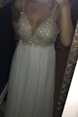 I originally ordered this dress in a 10 but then I found the 10 to be too big in the back area where it is open and the front area was sitting too low on my chest. I returned the size 10 and ordered an 8 which I think fits perfect! The open area in the back fits better and the front area by the chest fits perfect as well. My only problem is the zipper zips up all the way except for about half an inch, this is totally fine for me because I have 20 months until my wedding and I plan on losing more weight and toning up my back as well. I honestly love this dress it's absolutely beautiful, the beading on the front area is perfectly detailed and it fits so nice throughout the whole dress! I couldn't be more excited to have found my wedding dress on Lulus, I've ordered dresses from them before and have never been disappointed! Also when I called to ask questions about returning/exchanging my dress the customer service agent I spoke with was so helpful and made this experience that much better! - Taylor U.