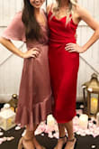 I loved wearing this dress to the last wedding I attended. The color is beautiful (a tad shiny though) and I got plenty of compliments. It's definitely more on the conservative side with the sleeves and length. I am typically a S/M and the small was still pretty loose. So depending on the fit you're going for, order a size down. - Alex O.