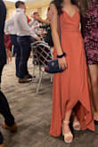this dress was perfect and such a dream. the wrap mechanism was much more sophisticated than i expected and i was able to wrap it around my waist very tightly. the material is great. color is gorgeous and is not at all muted in photos. the only thing i'd change is the length - i am 5/3 and even with 4'' heels i had to get about 5 inches cut off the bottom! other than the length, everything else was perfect. highly recommend - you will get lots of compliments :) - Francia