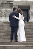 I bought this dress as a backup/nighttime dress for my August wedding. Well my now-husband and I moved up our wedding date 6 months and got married on a cold February day so the long sleeves were perfect! I love how it covers up so much skin but is still tight and sexy. You can see the moment in our wedding video when my husband first notices the back of the dress, and I think the way his eyes lit up says it all! Extremely classy, and I felt so glamorous! It was a little tricky finding undergarments, but I ended up using a stick on strapless/backless bra from target, and a tummy control thong from target. You could see the top of the tummy control band in some pictures of my back, but this could have been avoided if I had safety pinned or sewn the band down half an inch. I used a conair steamer to remove wrinkles, since I was scared an iron would melt the polyester fabric.

Unbeatable price for the quality/fit of the fabric. I can't recommend it enough! I felt so glamorous and beautiful on our wedding day. - Melody M.