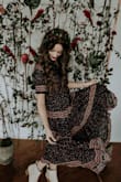 I LOVE this dress! It first perfectly. It's flowy but tight in the waist. I have no complaints! I was going to size up because of some of the reviews but I got a small (my normal size) and I have no problems! - Anna P.