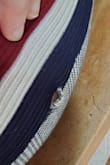 I wanted to love these pants. Other reviewers are correct that they loosen up after wear but it wasn't so bad that I cared. However, the construction is shoddy. They fit perfectly and I thought they were so cute, I didn't really examine them thoroughly before leaving for work. Once I arrived at work 40 minutes later, I realized that on the right leg, on one side of the stripe, it wasn't sewn well and there were gaps. I had to walk around work all day covering my outer thigh with my hand. This did not happen because they were too tight, in fact, the thighs were not even fitted to begin with. Also, it only happened on one leg, on one side of the stripe. Clearly a default. As I had already taken off the tags, I can't return them. I can see them, but even though I got them on sale for $38, I feel like that price should ensure I dont have to sew my own clothes. Attaching photos of the three holes in my pants. - Charity B.