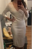 I love this dress, it's classy, elegant, and I can't wait to wear it to my engagement party! The thick material feels very high quality. The shape is nice. Minus 1 star because as I keep discovering with Lulus, the size chart don't really match the dresses that well. Got an XS and the shoulders are too large, and the length too long, but this was fixed with alterations. I felt like it was worth altering because I couldn't find a dress like this one and I wanted something form fitting, and personally having extra fabric at the shoulders bothers me. I'm definitely a pear and much bigger at my hips, and this dress had enough stretch to both fit my hips and accentuate my waist, something that's hard to find! - Sabrina B.