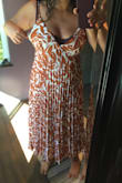 I wanted to love this dress so badly. The fabric is so soft  and the color is beautiful. Unfortunately the top part is not designed for bigger busted  women. The cleavage is way too low to be worn with a bra, but I can not not wear a bra, it just doesn't work.  I tried both L and XL. Fist photo is the L, fits better on the lower part but way too small on top. Second photo is the XL, which is too big on the underarm area but still too small for my big bust on the front. This seems to be a issue with most of the dresses I've tried from Lulus, they just don't design clothes right for big busted ladies (with the  exceptions of some wrap dresses). Hope they realize our big tatas need more room! - Melina C.