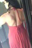 First of all, after wearing the dress for a few hrs I noticed that the side seam was coming undone. Lulus was gracious enough to give me a store credit as I had worn the dress already. But the dress straps system is just weird. The straps that adjust the front of the dress are attached to the straps that adjust the back so I you want to tighten your straps you need someone to help you tighten the whole dress in the back. With my big boobs I needed to have the front pretty tight so it would be supportive but it's not easy to tight the whole thing from the back and overall pretty uncomfortable. I decided to alter it by cutting the straps and separating the two systems and making it more of halter top (see second photo). Now I can adjust the the top and the torso separately. This dress has to be worn without a bra which may not work well for bigger breast women. I do love the rust color and after the alteration is more comfortable and manageable. - Melina C.