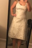 I ordered this dress to wear at my bridal shower. The material felt nice, but there were some loose threads at the bottom when I opened the package. The top was way too loose, but the waist fit snug. I chatted with a fit expert before ordering so I'm disappointed that the fit was so off. - Erica C.