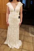 The quality is amazing of the dress! The shoulder area is a little big but I am like that in all dresses. The length was perfect! The picture I have no shoes on so with heels it will be great! - Chloe M.