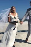 I am so so happy in choosing this dress to be my wedding dress! I didn't hem it or anything. I wore about 3.5" heels which was perfect height. This dress was perfect, lightweight, and loved the slit! I suggest wearing white or tan undergarments. The shoulder straps never got in the way and I never felt like I was restricted in lifting my arms. 100% recommend this dress. - Emily P.
