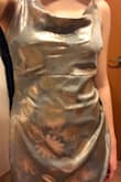 Achieves a nice silvery-gold look with a sage tint. Ends mid-calf at the back and just over the knee at the front. Ideally I'd prefer it to be ever so slightly tighter around the legs but I guess this dress is supposed to fall more naturally past the torso. Comfortable, and adjustable straps are extremely helpful! - Kaitlyn W.