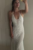 I ordered this dress along with a few others and honestly thought this would be my least favorite I even regretted ordering it. But once I tried it on it is so flattering! The shape is beautiful the beading is very nice my mother in law couldn't believe the price for how gorgeous this dress looks it looks like a legit gown. It's the one I'll be wearing for my wedding! I paired it with a tulle veil from amazon and absolutely love it! - Anjelica S.