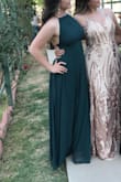 I loved this dress! I ordered a medium originally & was going to get it tailored because I wanted it more fitting- ended up just ordering an extra small and it fit perfectly! And was able to return the medium and be refunded- so excellent customer service. I loved the adjustable straps and the flowliness of the dress! The only thing I personally had to face was supporting my chest- ended up just using some duct tape for the night lol. - Hailey C.