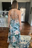 So flattering, love how it flows. Should note it's not easy to get in and out of and the top is tight enough a bra is not necessary. - Katherine F.