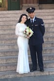 I wore this dress for my wedding day and I loved it! The material is soft and looks well made. We had a smaller wedding so I felt that this dress was the perfect amount of formal yet simple. The fit of the dress fitted without being too tight. I usually wear a 3/4 dress size. Since I am short I did have to get it hemmed a few inches even though I was wearing wedges but I expected that. Overall, I would highly recommend this dress. - Megan Y.