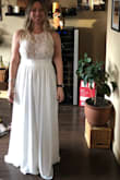 Reading other people's reviews on this dress helped me pick the right size! The dress is wonderful. I'm short so it's way too long but I hemmed it and it's perfect. The seamstress added bra cups as well. The material is great quality and feels so good on. I'm excited to wear this for my elopement. :) - Kelly M.